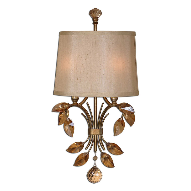 Uttermost Alenya 2-light gold wall sconce with sleek, modern design and elegant finish, mounted on a neutral wall.