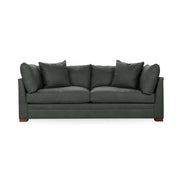 Classic Home Audrey stationary sofa with plush cushions and elegant design, showcasing a comfortable seating area.