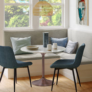 Simpli-Home Osborne dining table with wooden surface and sturdy legs, ideal for modern dining rooms.