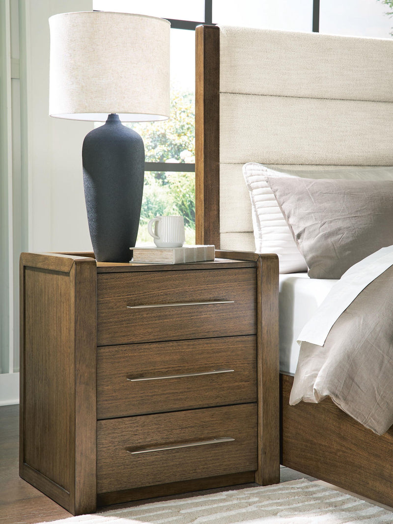 Benchcraft Marxmore brown three drawer nightstand with built-in charging station, wood finish, and modern design.
