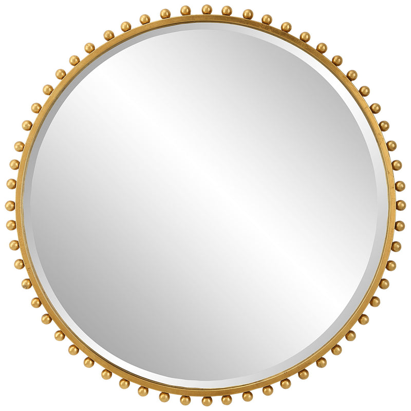 Round iron wall mirror by Uttermost with a sleek, minimalist frame, perfect for modern interior decor.