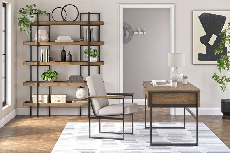 Light brown Montia home office 3-piece set by Signature Design Ashley includes a desk, chair, and bookcase in a modern style.