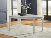 Montelaine - Oval Dining Room Extension Table - Antique White - R&R Furniture Gallery (Fountain Valley, CA)