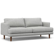 Livingston upholstered stationary sofa by Simpli-Home with plush fabric and cushioned seating in a modern living room setting.