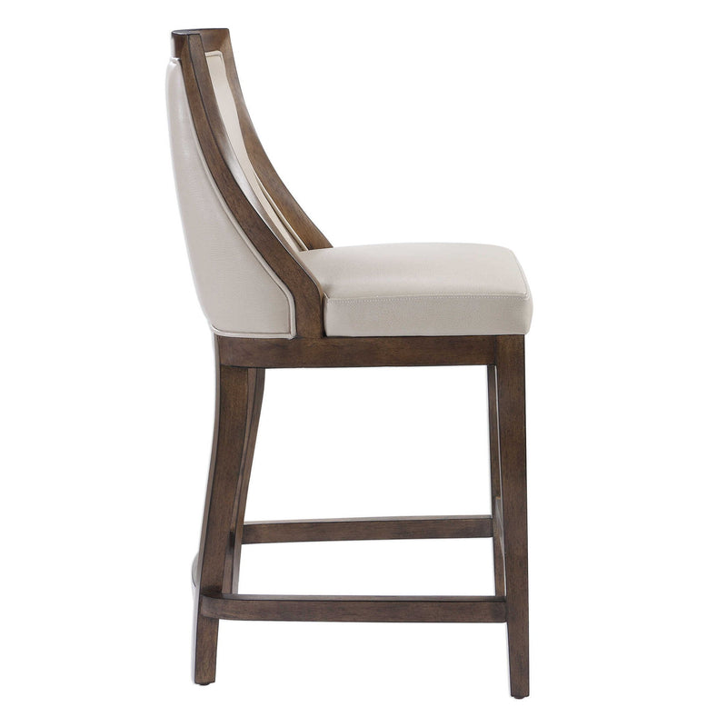 Uttermost Purcell beige counter stool with wooden legs and upholstered seat at counter height, 24-27 inches.
