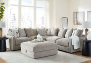Benchcraft® Aslan Court 5-piece sectional living room set with matching ottoman, featuring plush upholstery and modern design.