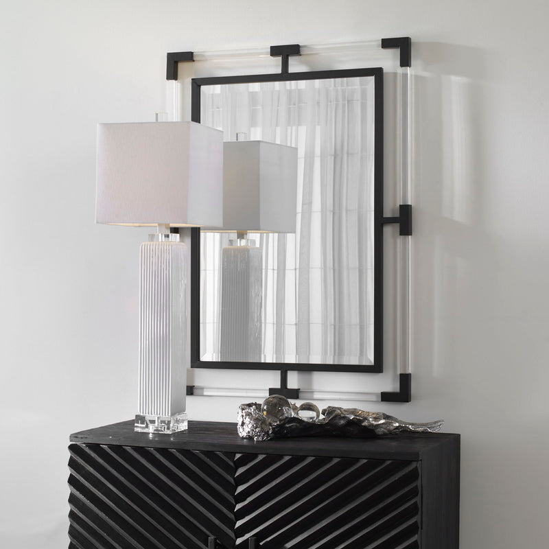 Uttermost Balkan Iron Wall Mirror featuring an ornate metal frame with intricate details and a vintage-inspired design.