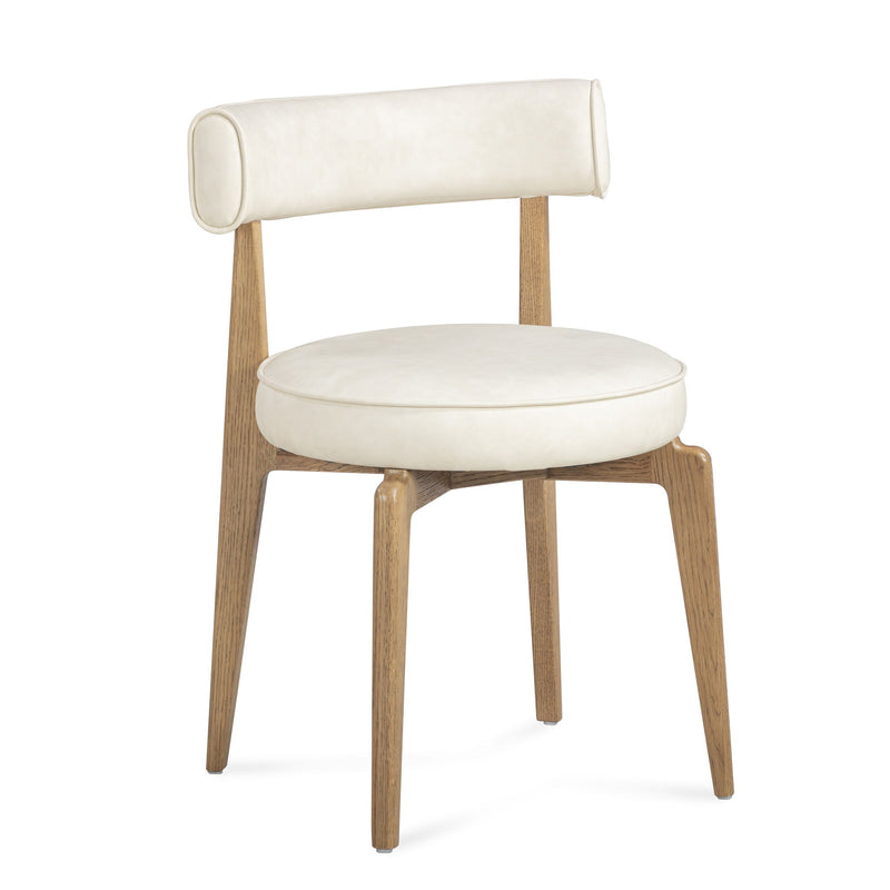 TOV Furniture Nikita dining side chair with sleek modern design and wooden legs, shown in a stylish home setting.