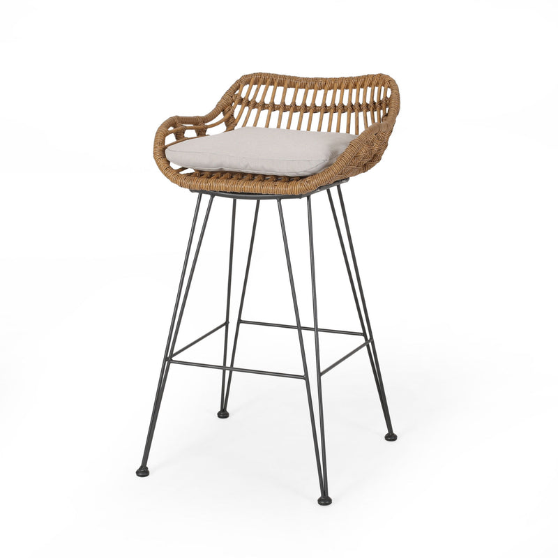 Noble House outdoor rattan bar stool with metal legs, stylish seating for patio or outdoor bar area.