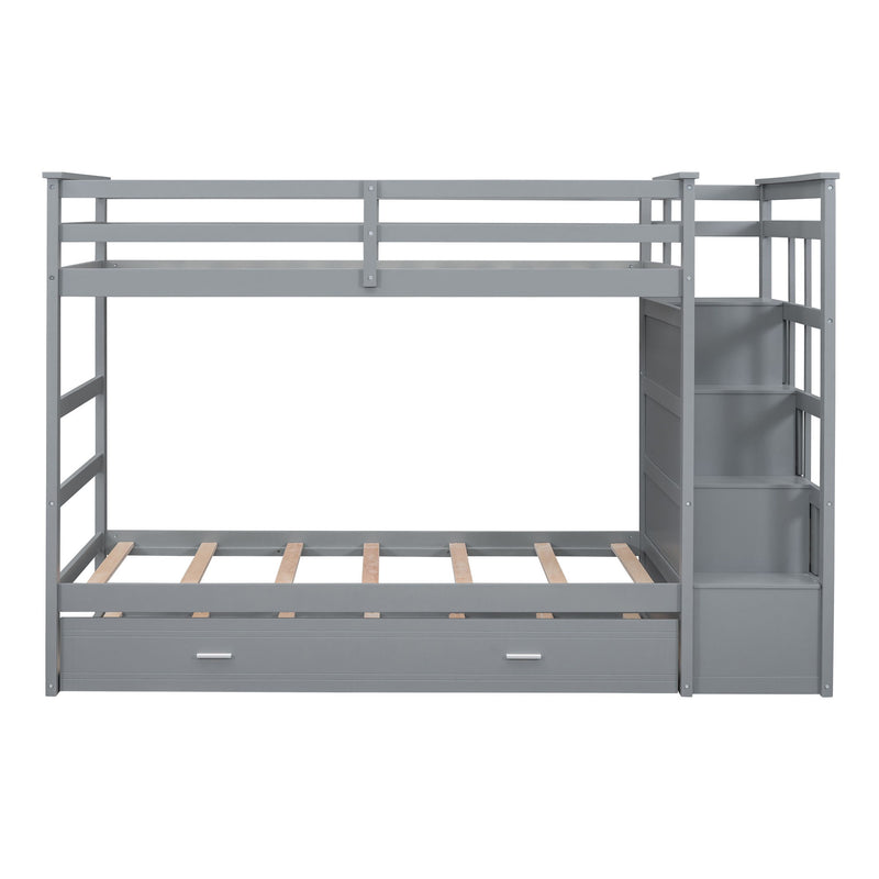 DreamHaus bunk bed with trundle and staircase, featuring sturdy wooden frame, ladder, and space-saving design for kids' room.
