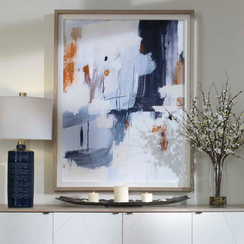 Abstract blue framed print by Uttermost, modern artwork on a white background with a sleek black frame.