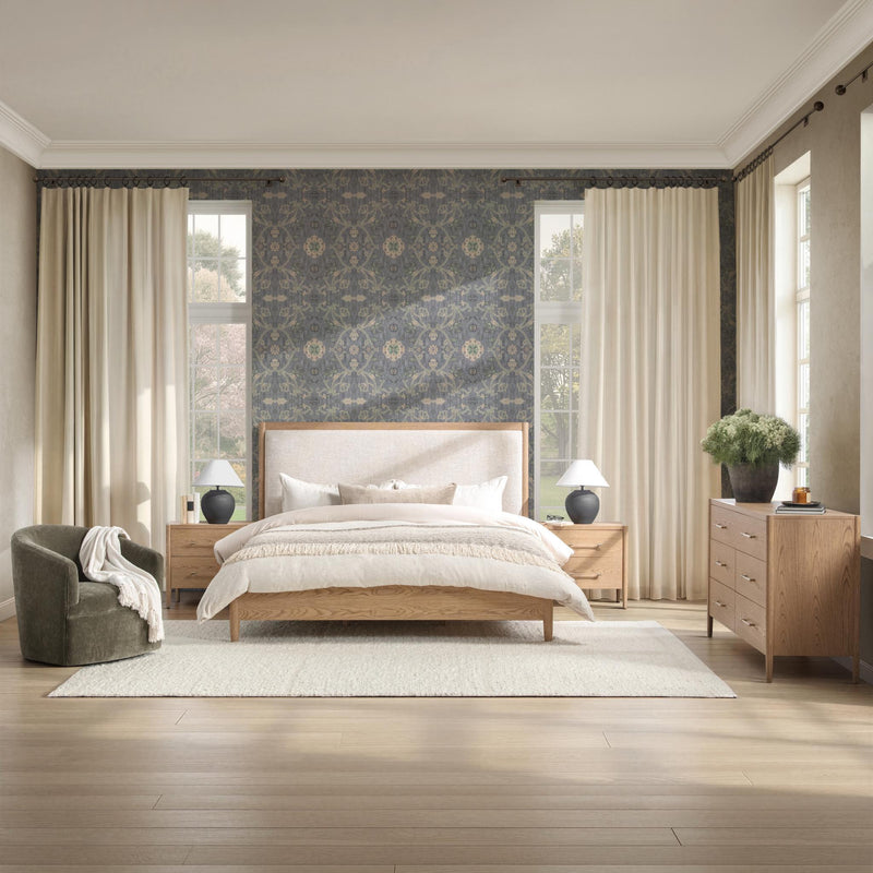 Alisen upholstered bed by Classic Home featuring a padded fabric headboard and a sturdy wooden frame in a modern bedroom setting.