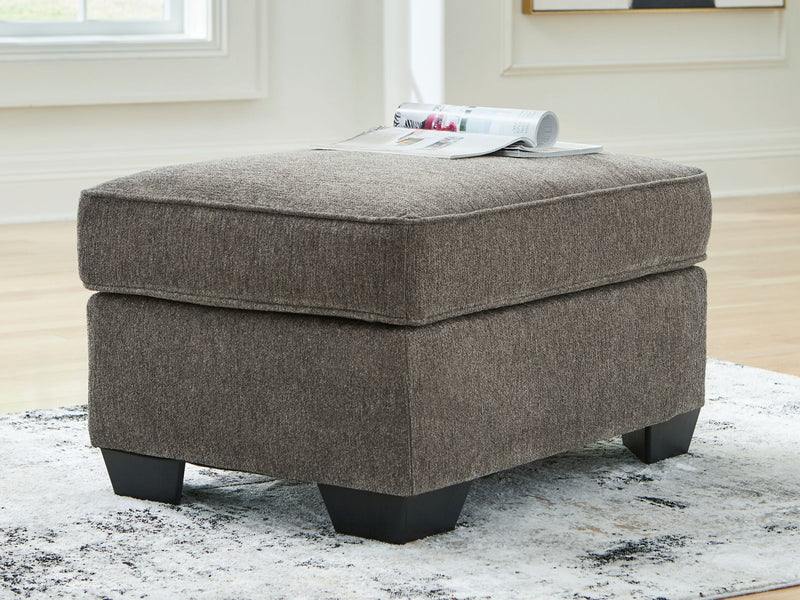 Benchcraft® Olten accent ottoman with soft fabric upholstery and a simple, modern design suitable for living room decor.