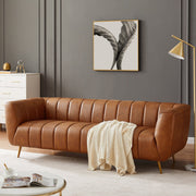 Ashcroft Furniture Ava gold and tan stationary sofa with plush cushions and sleek design, perfect for modern living rooms.