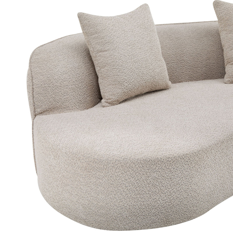 Elegant curved Noble House sectional sofa with plush foam cushions, showcasing a modern stationary sofa design.