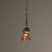 Uttermost Vitalia mini pendant light in oil rubbed bronze with a sleek, modern design hanging from a ceiling fixture.