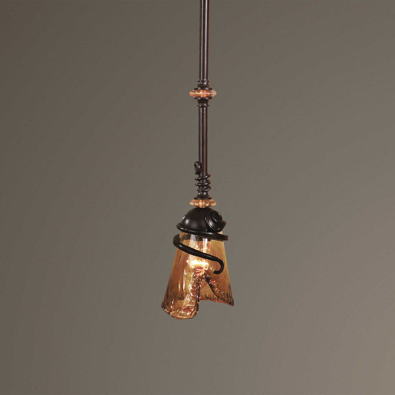 Uttermost Vitalia mini pendant light in oil rubbed bronze with a sleek, modern design hanging from a ceiling fixture.
