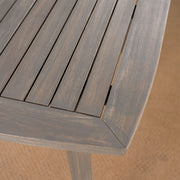 Modern indoor square dining table with acacia wood surface and toothpick leg design by Noble House.