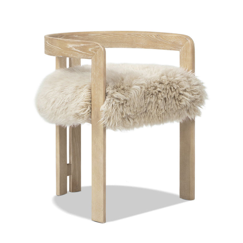 Jennifer Taylor Home Millwick low back dining chair with natural blonde wood finish, armrests, and modern design.