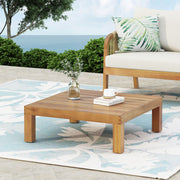 Noble House Mythical square outdoor coffee table with teak frame and slat top, designed for stylish patio or garden seating areas.
