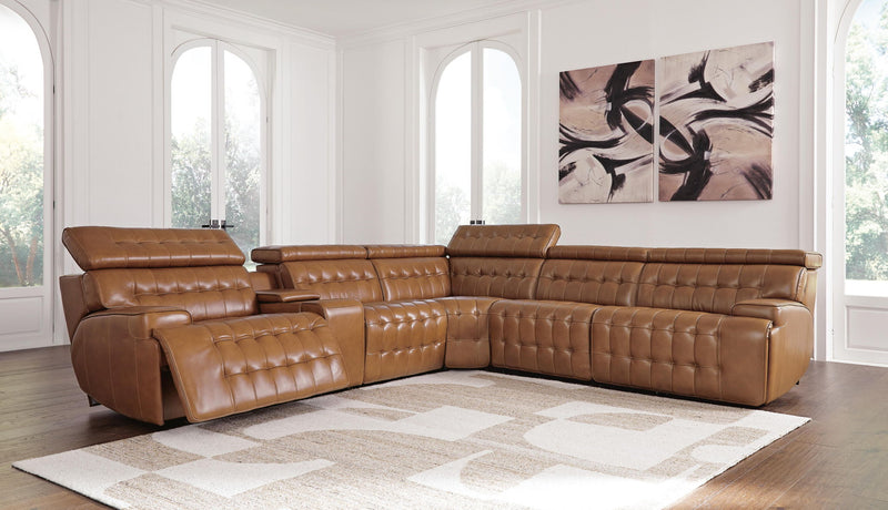 Signature Design by Ashley Temmpton power reclining sectional sofa with multiple seats and plush cushions in a modern living room setting.