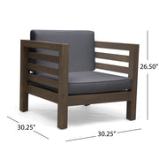 Noble House outdoor acacia wood patio arm chair with fabric cushion, showing a sturdy wooden frame and comfortable seating.