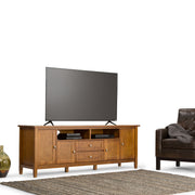 Handcrafted Warm Shaker TV media stand by Simpli-Home, featuring wood finish and storage compartments for media devices.