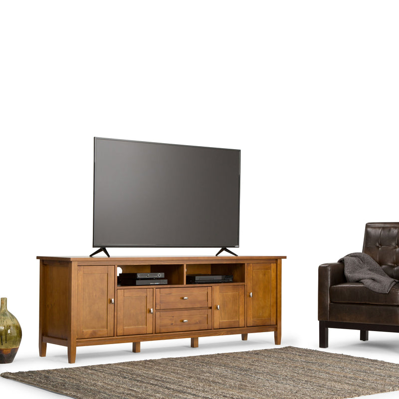Handcrafted Warm Shaker TV media stand by Simpli-Home, featuring wood finish and storage compartments for media devices.