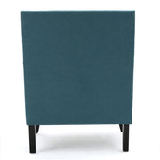 Noble House Serenada upholstered fabric arm chair with nailhead trim and tapered birch wood legs in a stylish living room setting.