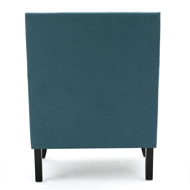 Noble House Serenada upholstered fabric arm chair with nailhead trim and tapered birch wood legs in a stylish living room setting.