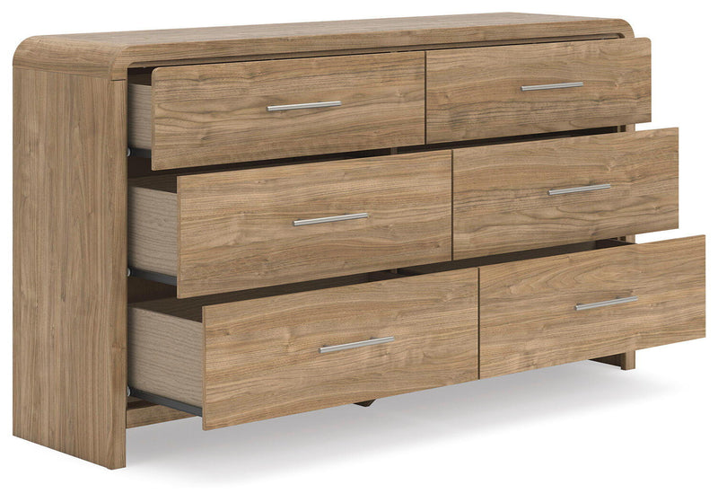 Signature Design by Ashley six-drawer dresser with sleek wood finish and modern hardware for stylish bedroom storage.