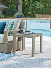 Signature Design by Ashley Kimpton Isle coffee table with a sleek wooden surface and modern metal legs.