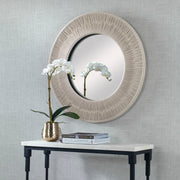 Round wall mirror with a sailor's knot design by Uttermost, featuring nautical-inspired decorative frame.