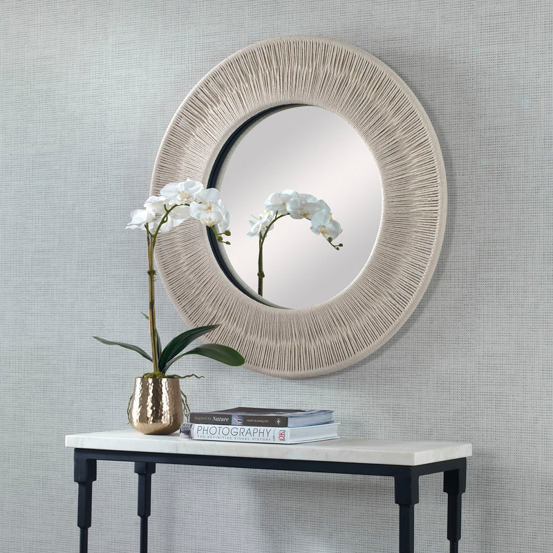 Round wall mirror with a sailor's knot design by Uttermost, featuring nautical-inspired decorative frame.