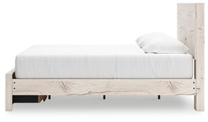 Signature Design by Ashley Lawroy panel bed with storage drawers, showcasing a modern wood finish and built-in under-bed storage space.