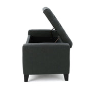 Dark gray Noble House storage ottoman with a tufted top, showcasing a contemporary design and plush cushioning.