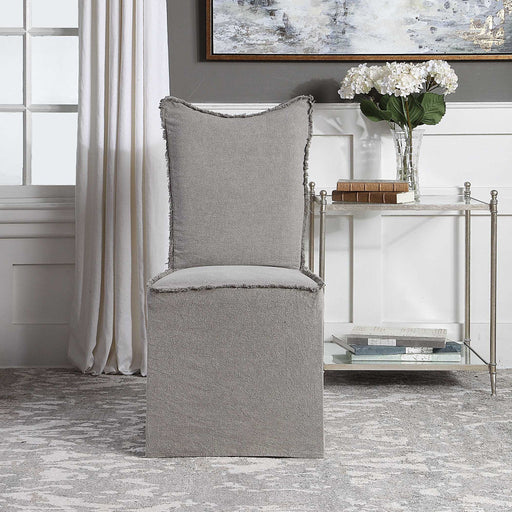 Set of two gray Narissa armless chairs by Uttermost, with sleek modern design and upholstered fabric seats.