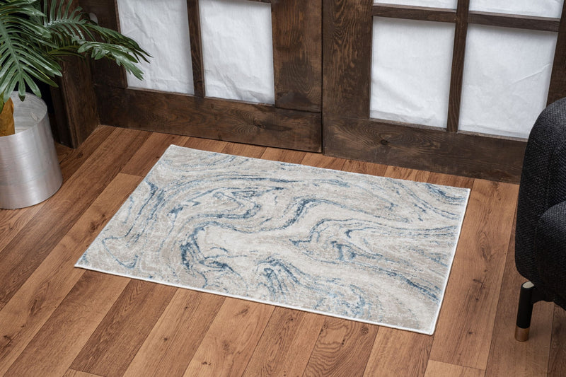Elegance - 5'3" X 7'3" Polyester Area Rug - Ivory - R&R Furniture Gallery (Fountain Valley, CA)