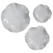 Set of three ceramic wall decor pieces by Uttermost, featuring modern abstract designs for stylish wall decoration.