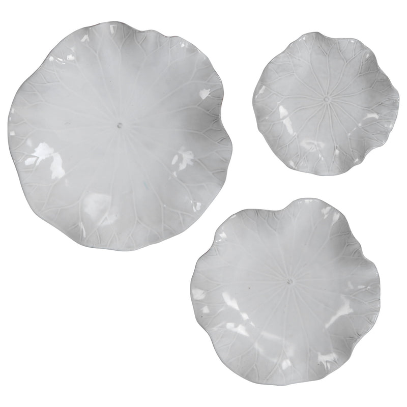 Set of three ceramic wall decor pieces by Uttermost, featuring modern abstract designs for stylish wall decoration.