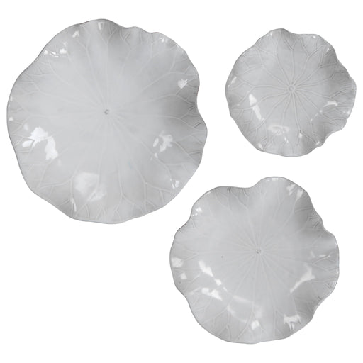 Set of three ceramic wall decor pieces by Uttermost, featuring modern abstract designs for stylish wall decoration.