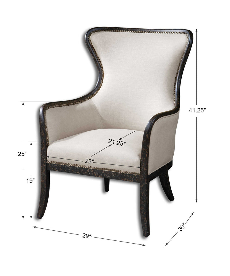 Uttermost Sandy wing back armchair in beige and dark brown fabric with plush cushioning and elegant wooden legs.