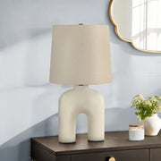 Cream resin modern table lamp by 8th Street with a sleek, minimalist design perfect for contemporary home decor.