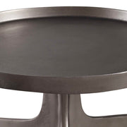 Uttermost Kenna accent table with a sleek round top and modern metal base, ideal for stylish living room or bedroom decor.