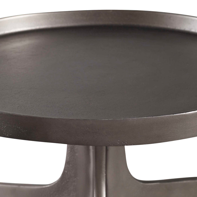 Uttermost Kenna accent table with a sleek round top and modern metal base, ideal for stylish living room or bedroom decor.