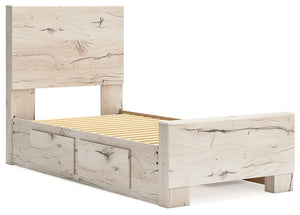 Signature Design by Ashley Lawroy panel bed with built-in storage drawers in a modern bedroom setting.