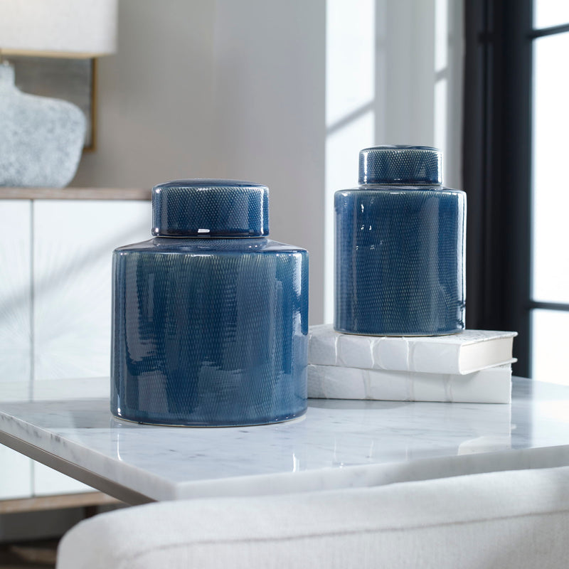 Set of two blue Saniya containers by Uttermost, decorative vases and jars with textured surfaces for stylish home decor.