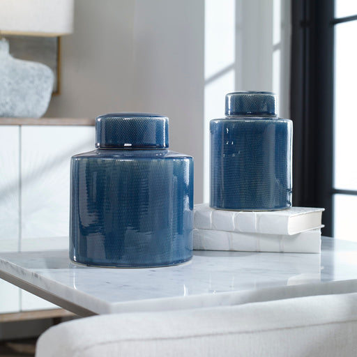 Set of two blue Saniya containers by Uttermost, decorative vases and jars with textured surfaces for stylish home decor.