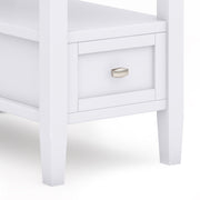 Warm Shaker handcrafted coffee table by Simpli-Home with a smooth wooden surface and sturdy legs in a classic shaker style.