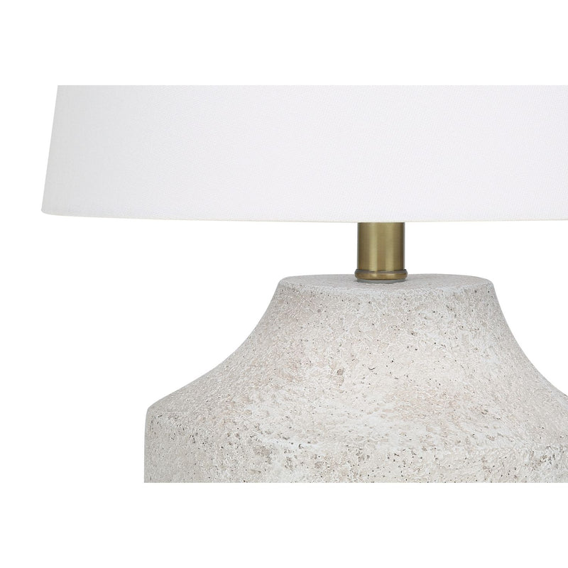 Modern cream concrete table lamp by 8th Street, featuring a sleek minimalist design and sturdy cylindrical shape.